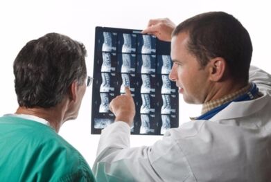 The doctor looks like spinal images